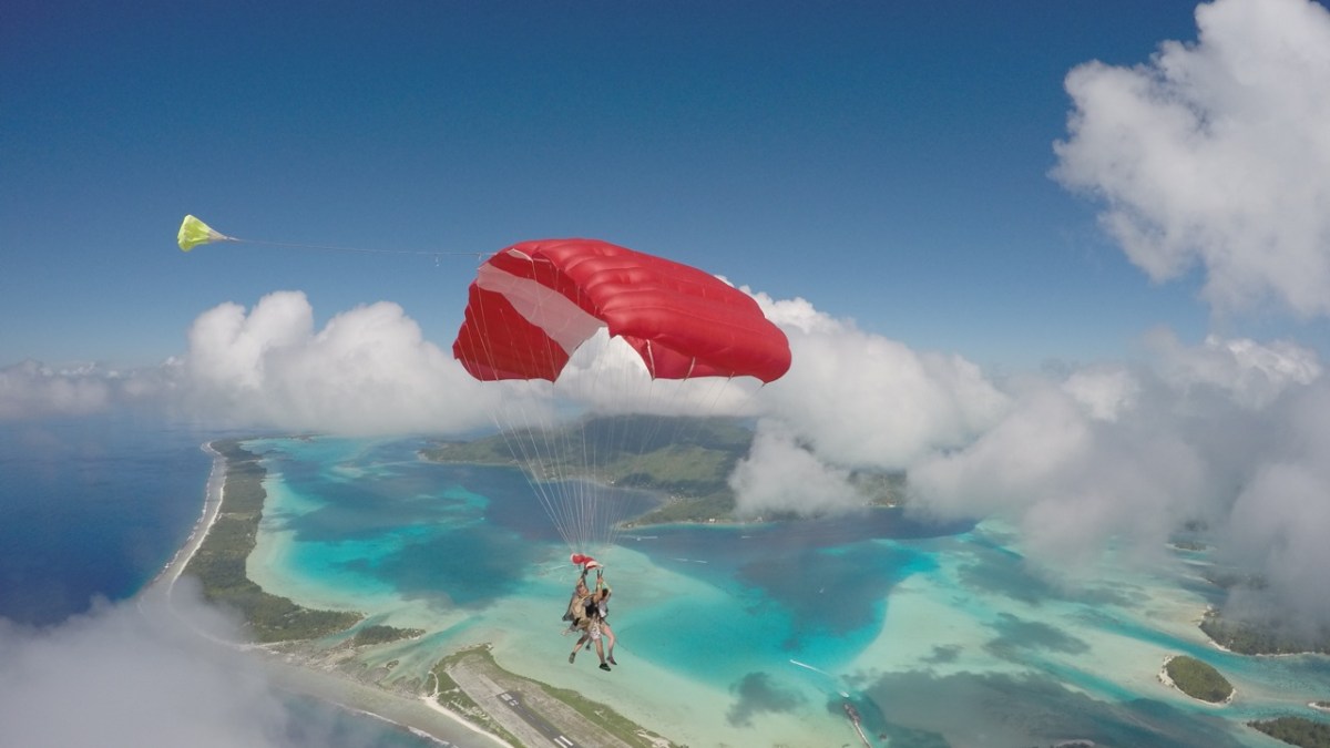 a group of clouds in the blue water