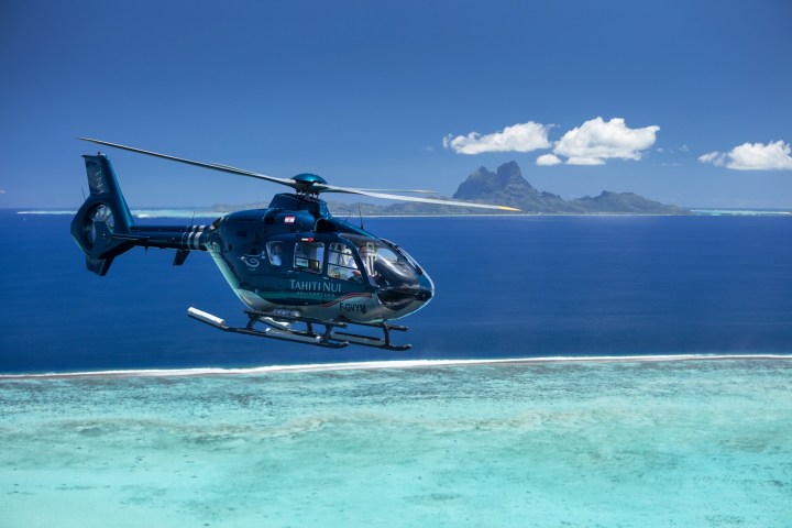 a plane flying over a body of water